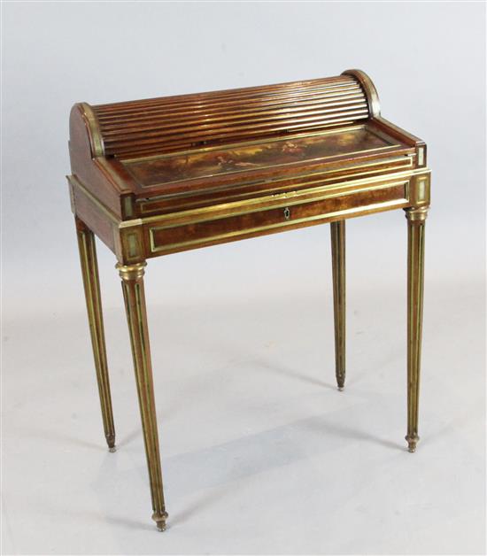 A late 19th century Louis XVI style brass moulded mahogany writing table, W. 68cm